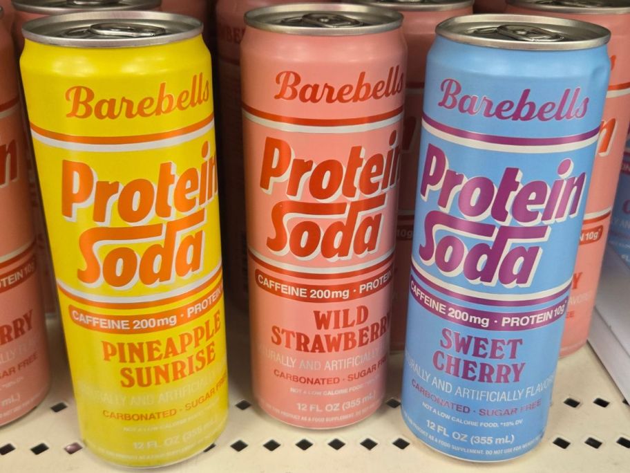 3 cans of Barebells Protein Soda in different flavors