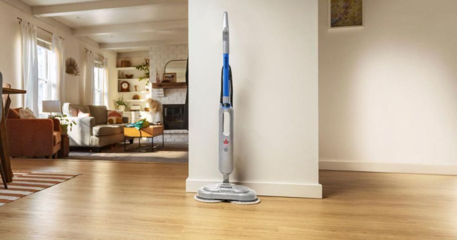 A Bissell SpinWave Steam Mop on a hardwood floor
