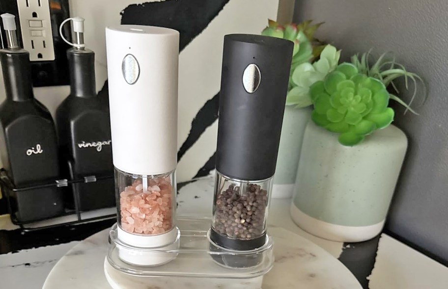 and & black salt & pepper grinder set on kitchen counter
