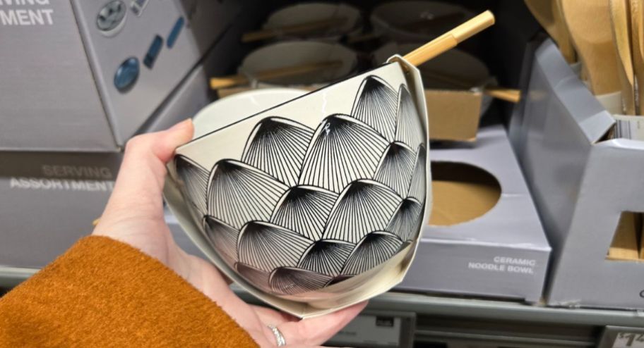 hand holding Ceramic noodles at the store