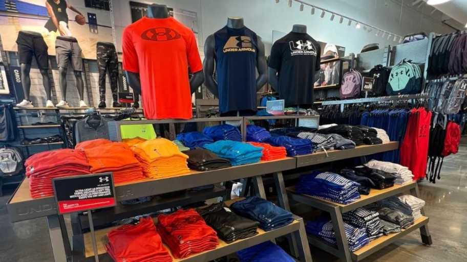 Under Armour clothing on display in a store