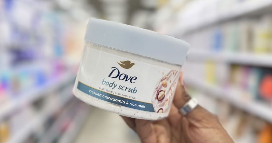 Hand holding a Dove body Scrub