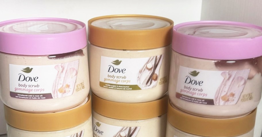 stacked jars of Dove Body Scrubs