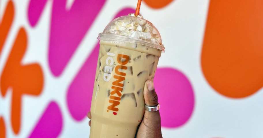 hand holding up a large dunkin' iced coffee