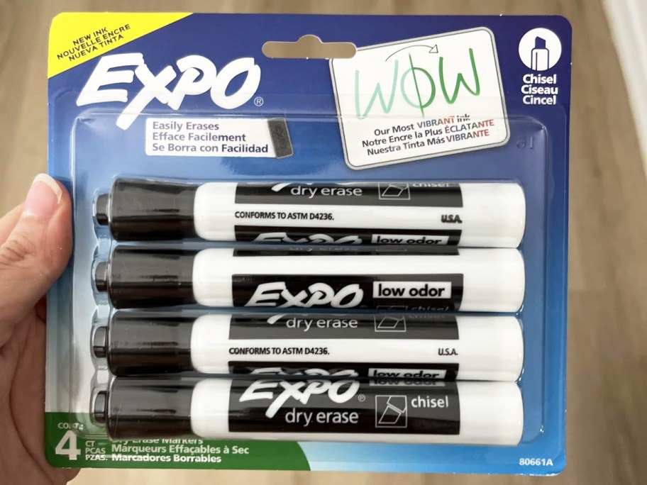 hand holding a pack of black EXPO Dry Erase Markers