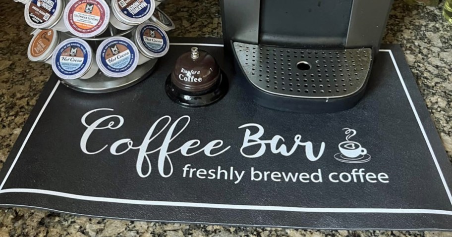 black countertop mat that says coffee bar on it