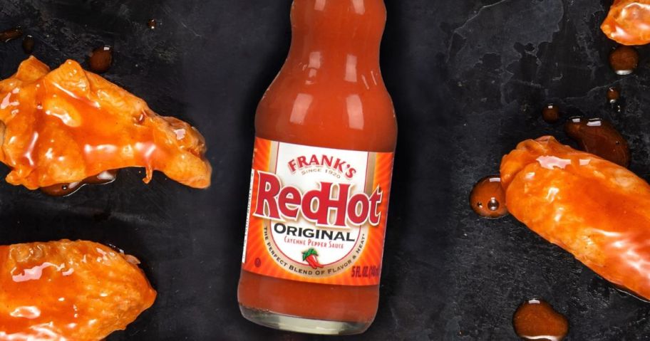 Franks RedHot Sauce surrounded by wings