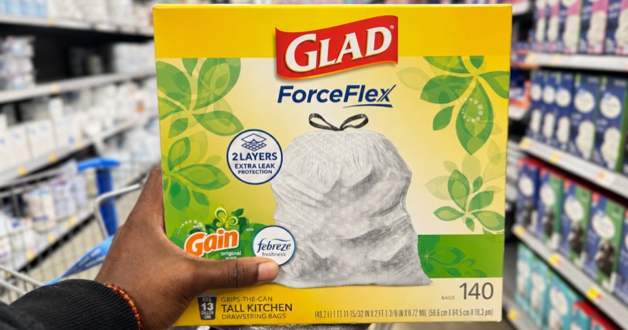 hand holding a box of Glad ForceFlex Trash Bags in store