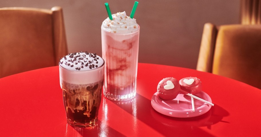 cups of Starbucks drinks and heart shaped cake pops on a table