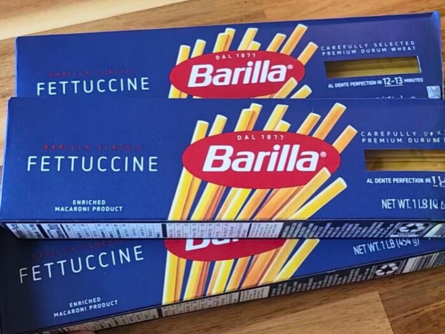 3 boxes of Barilla fettucine pasta on a counter