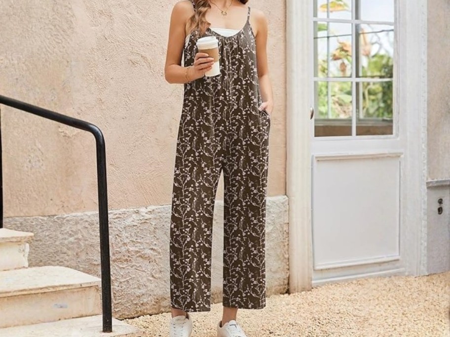 woman wearing a wide leg pants romper with a tank top