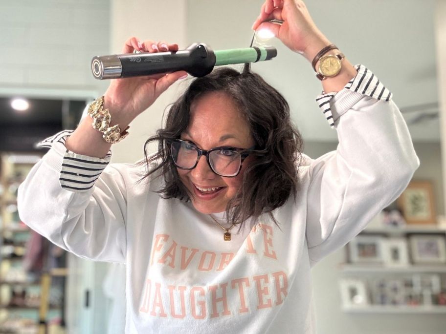 Woman using a Harry Josh Pro Curling Wand