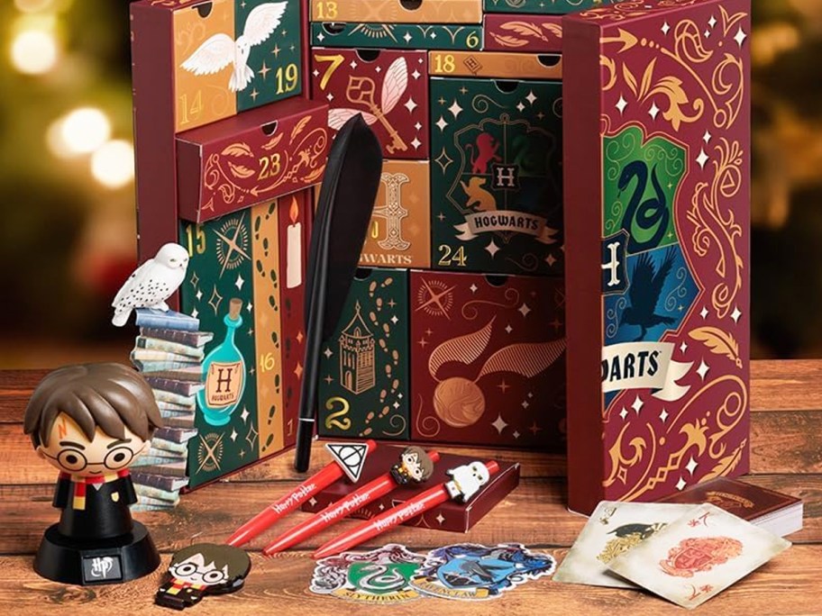 harry potter advent calendar box with colorful drawers and items displayed in front of it