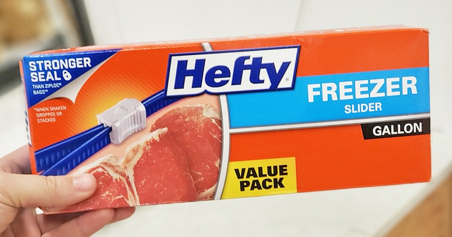 hand holding a box of Hefty Slider Gallon Freezer Bags 