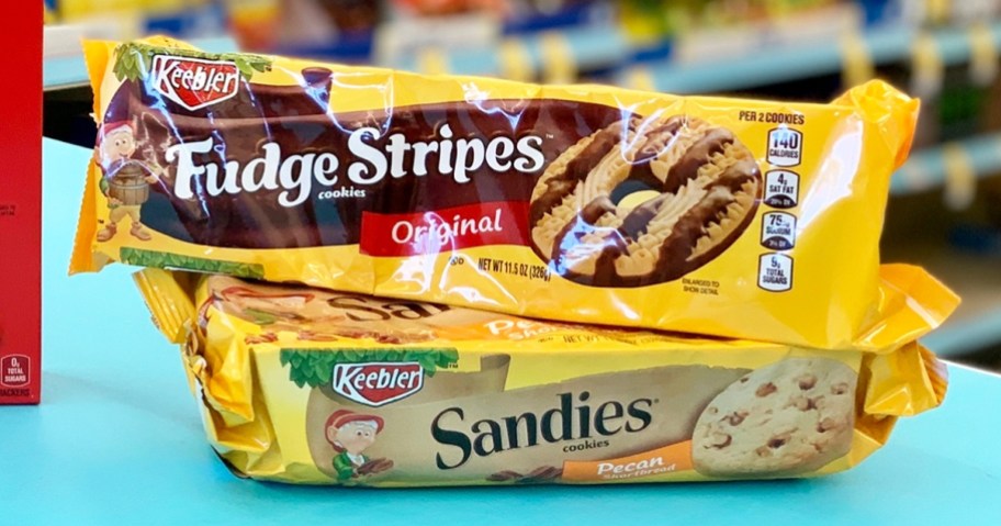 two packs of keebler cookies stacked on a blue table