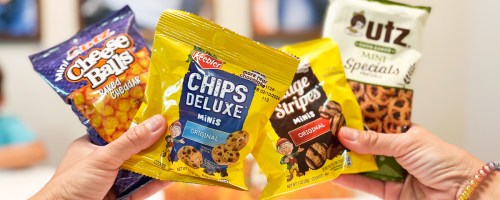 hands holding up multiple packs of Keebler snacks