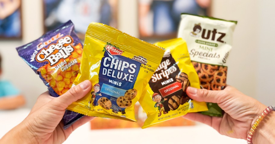 hands holding up multiple packs of Keebler snacks
