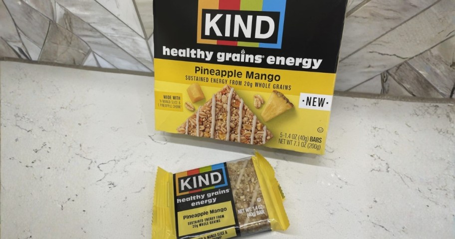 kind bars healthy grains energy pineapple mango bar on counter with box
