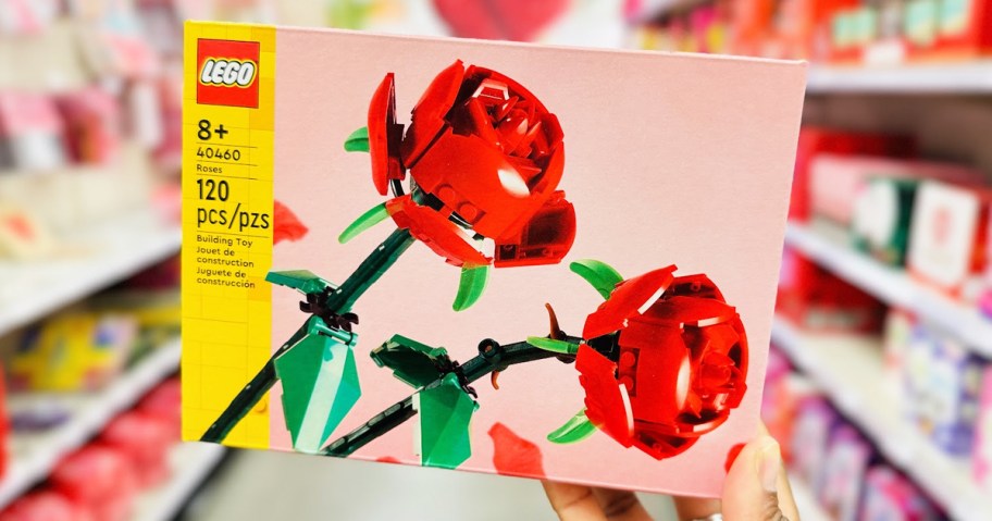 woman's hand holding a box of LEGO roses