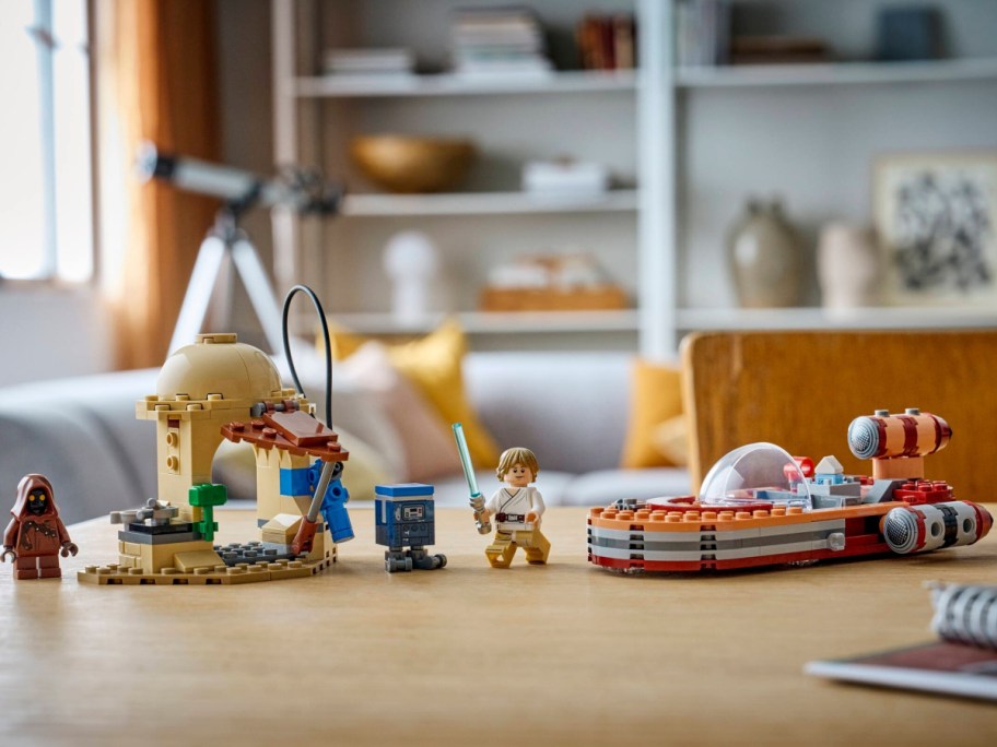 A LEGO Smart Play Star Wars Luke's Landspeeder set on a table.