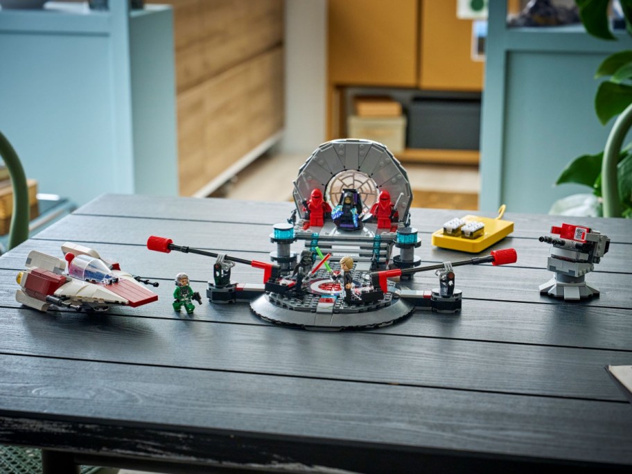 A LEGO Smart Play Star Wars Throne Room Duel & A-Wing set on a table.