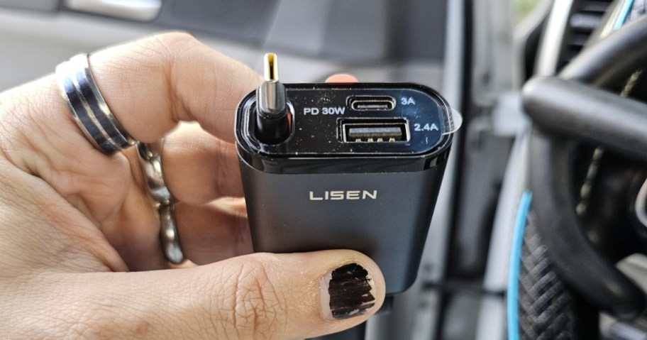 person holding lisen retractable 3-in-1 car charger