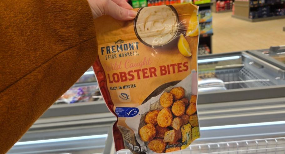 hand holding Lobster bites at the store