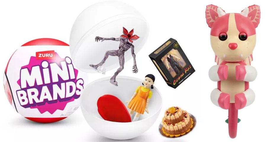 A mini verse egg opened revealing tiny movie toys and a pink dragon 