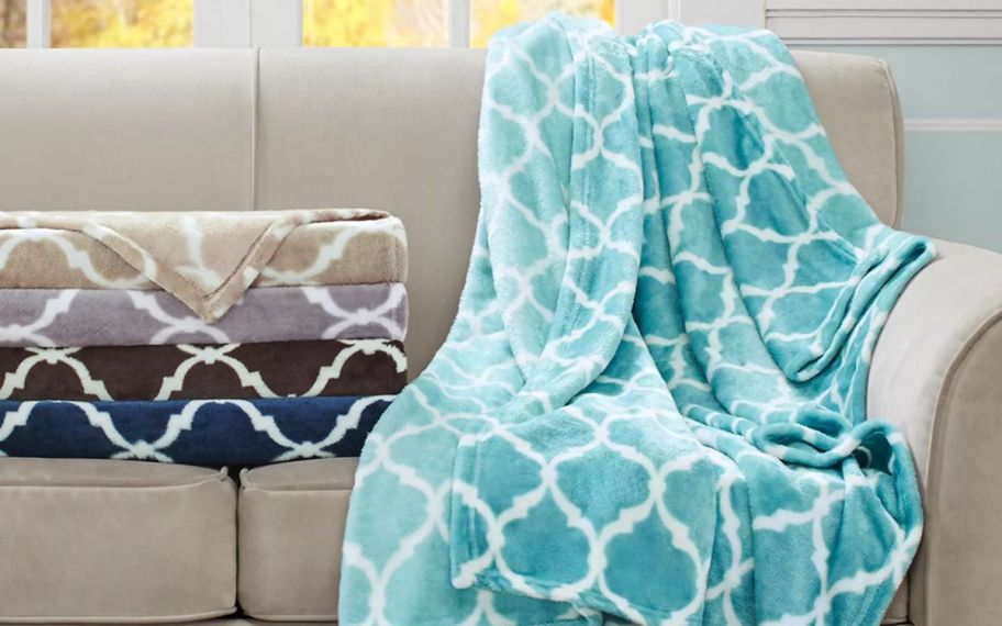 Macys throw blankets on top of the couch