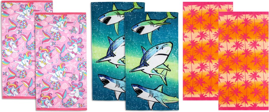 beach towel 2-packs in mermaid unicorns, sharks, and palm tree prints