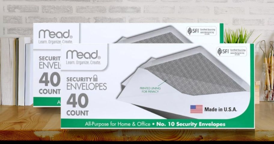 boxes of Mead Security Envelopes on a desk 