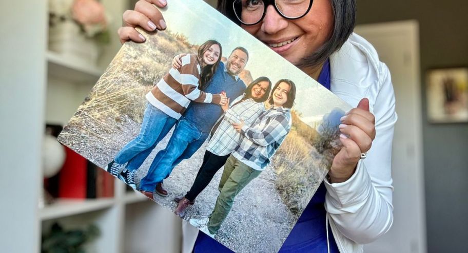 woman holding metal panel 