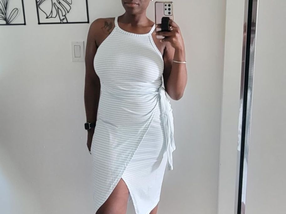 woman wearing striped wrap dress