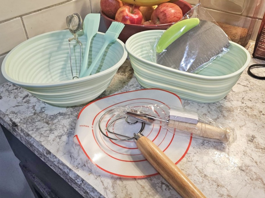 sourdough bread proofing baskets and accessories on kitchen counter