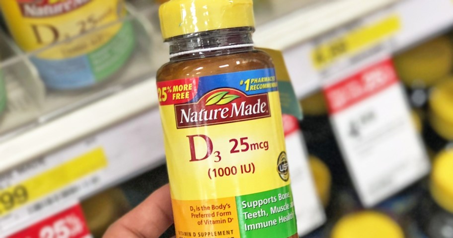 hand holding up a bottle of Nature Made Vitamin D3 in store