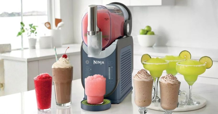 Ninja SLUSHi 88oz Professional Frozen Drink Maker on counter with drinks around it