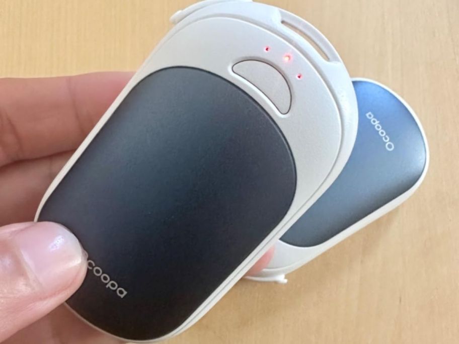 Hand holding an An Occopa Hand Warmer