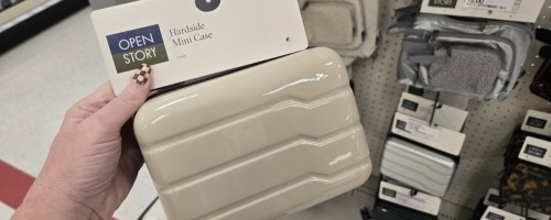 hard sided travel dopp cases hanging on shelf in target