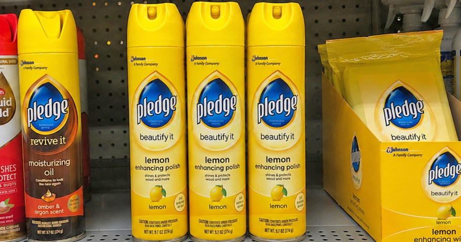 yellow bottles of Pledge Wood Polish Spray on a store shelf