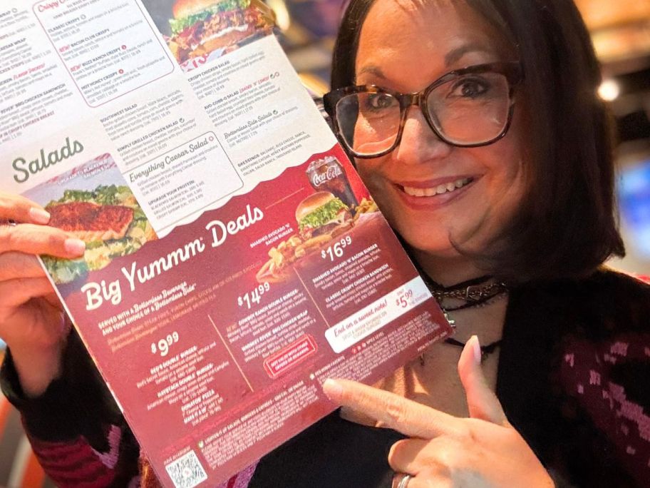 Woman pointing to the Big Yumm Setion on a Red Robin menu