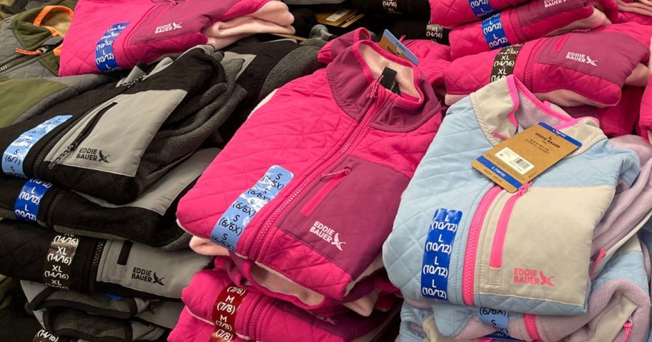 Stacks of folded Eddie Bauer Kids Jackets at Sam's Club