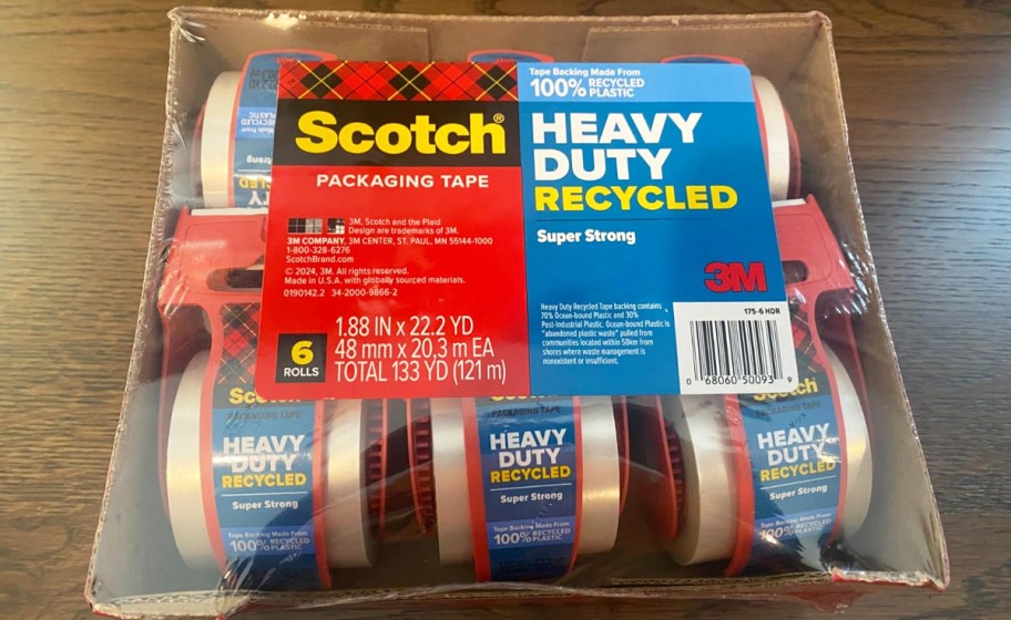 case of Scotch Heavy Duty Recycled Packaging Tape dispensers on a wood table