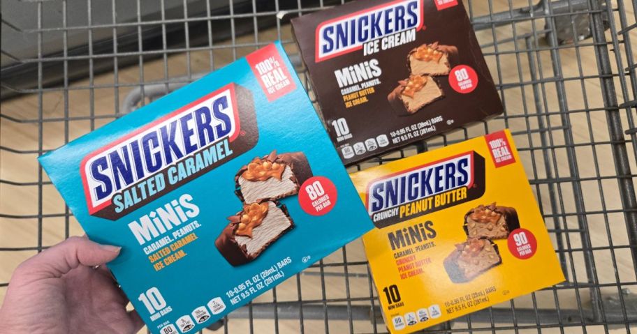 A kroger Cart with 3 boxes of Snickers Mini Ice Cream bars
