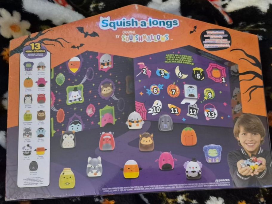 back of Squish-a-longs Halloween Countdown Calendar box on blanket