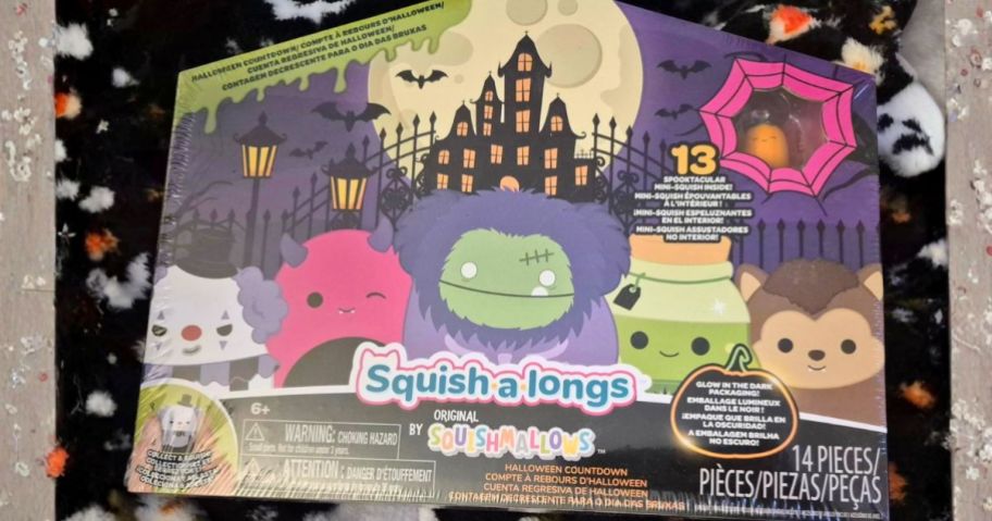 Squish-a-longs Halloween Countdown Calendar box on Halloween throw blanket