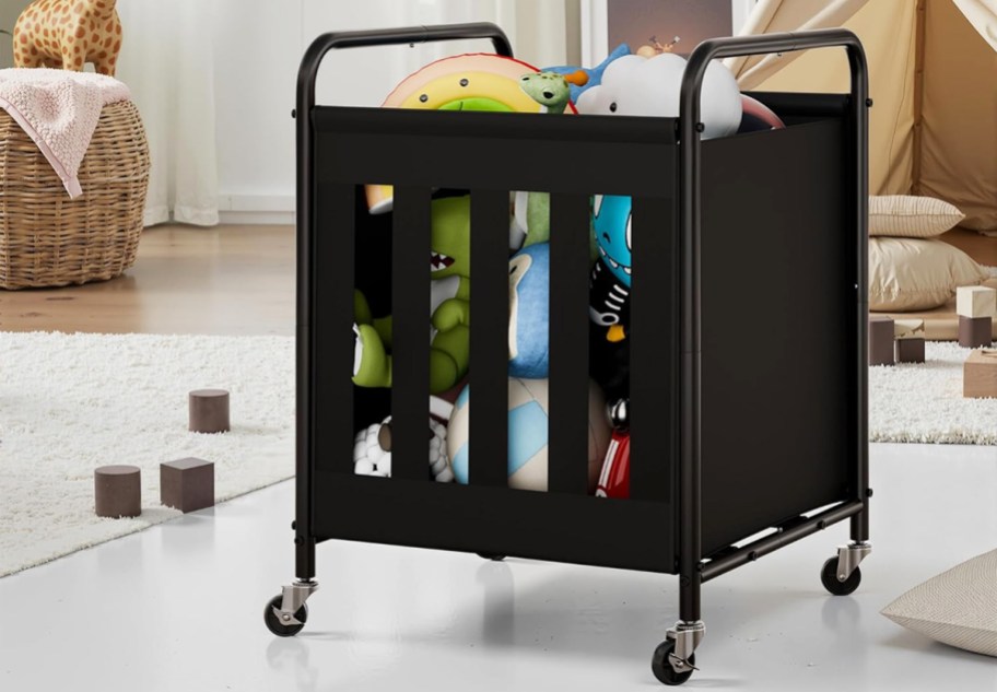 stuffed animals inside a black storage cart