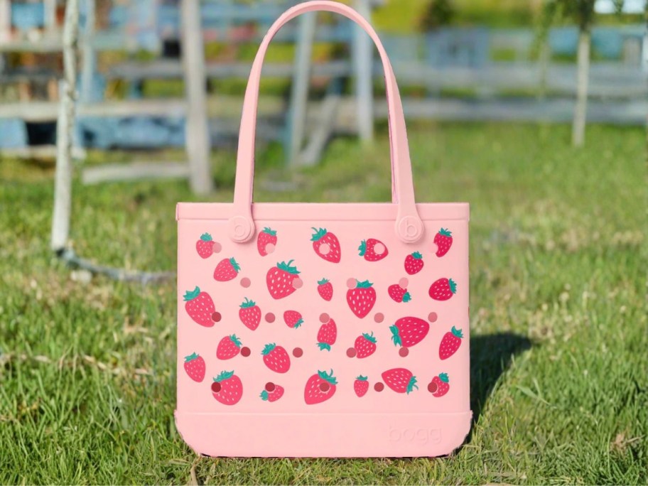 strawberry printed bogg bag on grass