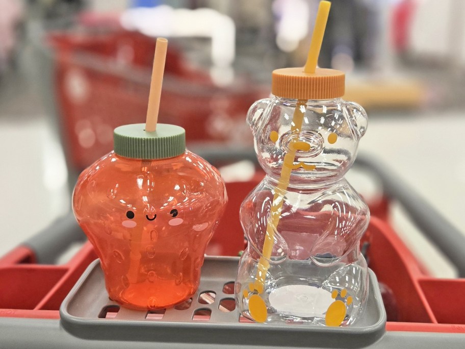 strawberry and honey bear sipper cups in a target shopping cart