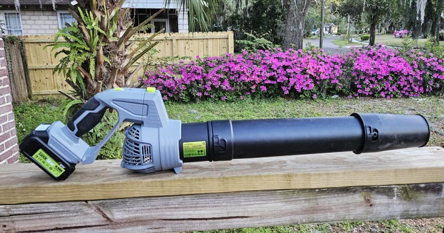 grey and black leaf blower on edge of patio