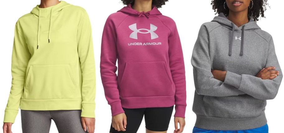 three women in green, pink, and grey under armour hoodies